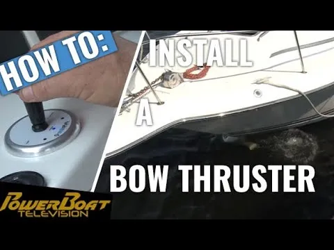 A still from PowerBoat TV: a hand on a thruster joystick at a helm, beside a boat at a dock, titled How to install a bow thruster.