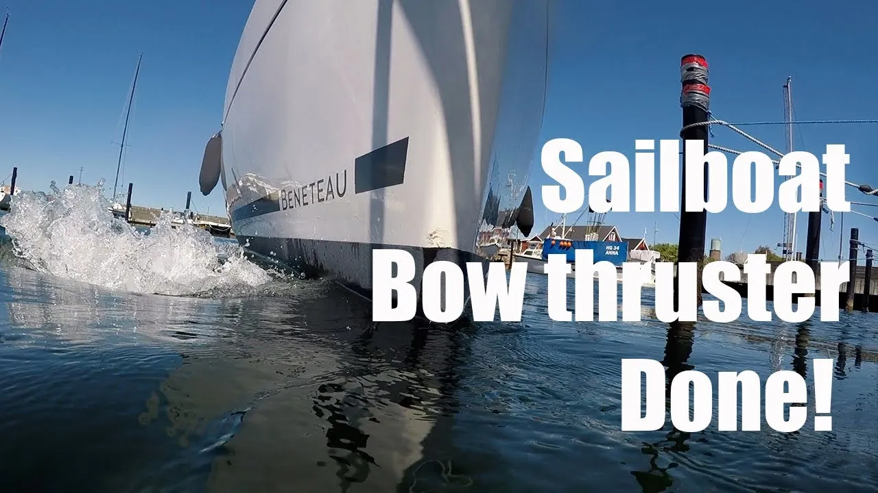 A still from She is the captain: a Beneteau sailboat pushing water out of its new bow thruster at a dock, titled Sailboat bow thruster done.